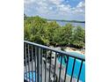 Relaxing pool area with lake view from balcony at 13415 Blue Heron Beach Dr # 106, Orlando, FL 32821