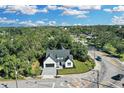 Aerial view showcasing the home's curb appeal and surrounding neighborhood at 155 Pearl St, Auburndale, FL 33823