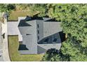 Top-down view of a house with a gray asphalt roof and dormers at 155 Pearl St, Auburndale, FL 33823