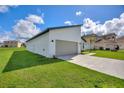 Attached two-car garage with ample space and a clean, modern design at 1877 Snapper Dr, Kissimmee, FL 34759