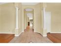 Bright and spacious entrance hall with tile flooring and hardwood floors at 2108 Drive Way, Kissimmee, FL 34746