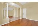 Elegant foyer with hardwood and tile floors, and arched doorways at 2108 Drive Way, Kissimmee, FL 34746