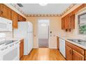 Kitchen with wood cabinets and view to dining area at 2900 Lake Arnold Pl, Orlando, FL 32806