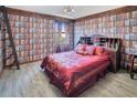 Bedroom with book-themed wallpaper and a large bed at 1430 Thunderbird Rd, Davenport, FL 33896