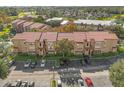 Aerial view of condo building with ample parking at 5132 Conroy Rd # 28, Orlando, FL 32811