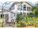 Inviting entryway with stone pathway and lush landscaping at 4801 Beach Blvd, Orlando, FL 32803