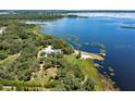 Lakefront property with a house, pool, and private dock at 17017 Marsh Rd, Winter Garden, FL 34787