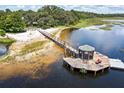 Lakefront gazebo and long dock perfect for relaxing at 17017 Marsh Rd, Winter Garden, FL 34787