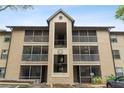 Condo building entrance with balconies and screened porches at 623 Dory Ln # 308, Altamonte Springs, FL 32714