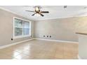 Spacious living room with tile floors and ceiling fan at 623 Dory Ln # 308, Altamonte Springs, FL 32714