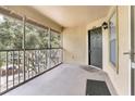 Private screened balcony with door access to condo unit at 623 Dory Ln # 308, Altamonte Springs, FL 32714
