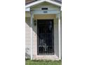 Front door with decorative wrought iron security door at 1685 S Wallace Ave, Bartow, FL 33830