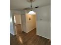 Dining area with hardwood floors and a light fixture at 6008 Village Cir # Ge, Orlando, FL 32822