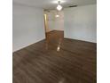 Spacious living room with hardwood floors and neutral walls at 6008 Village Cir # Ge, Orlando, FL 32822