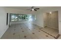 Bright living room featuring tile floors and a large window at 1316 N. Amelia Avenue, Deland, FL 32724