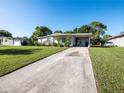 Ranch home with long driveway and mature landscaping at 2816 Paine Ln, Orlando, FL 32826