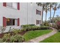 Landscaped walkway and building exterior at 4575 S Texas Ave # 109, Orlando, FL 32839