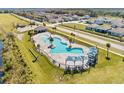 Community pool and surrounding area with houses in background at 4953 Kaia Ave, Winter Haven, FL 33884