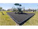 Community playground with safe surfacing and play equipment at 4953 Kaia Ave, Winter Haven, FL 33884