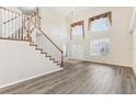 Spacious living room with high ceilings, hardwood floors, and large windows at 6526 Lake Pembroke Pl, Orlando, FL 32829