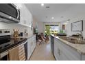 Modern kitchen with granite countertops and stainless steel appliances at 700 Preston Cove Dr, St Cloud, FL 34771