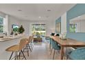 Open concept kitchen and living area with breakfast bar and backyard access at 704 Preston Cove Dr, St Cloud, FL 34771
