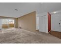 Spacious living room with carpet and access to balcony at 604 Kenwick Cir # 202, Casselberry, FL 32707