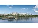 Community lakefront view with dock and building in background at 14501 Grove Resort Ave # 2122, Winter Garden, FL 34787