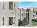 Exterior view of condo building and walkway at 3012 Parkway Blvd # 102, Kissimmee, FL 34747