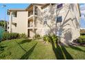 Condo building exterior with landscaping at 3012 Parkway Blvd # 102, Kissimmee, FL 34747