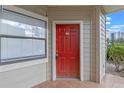 Red front door entry to condo unit 102 at 3012 Parkway Blvd # 102, Kissimmee, FL 34747