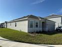 One story home with light gray exterior and a two-car garage at 5231 Maddie Dr, Haines City, FL 33844