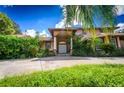 Two story house with double door entry and lush landscaping at 5660 County Road 561, Clermont, FL 34714