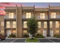 Townhome building at dusk, well-lit and modern at 3215 Brasilia Ave, Kissimmee, FL 34747