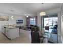 Open concept dining area with glass table and access to the patio at 4285 Quote St, Kissimmee, FL 34746
