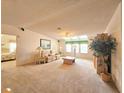 Spacious living room with lots of natural light and comfortable seating at 6604 Scenic Point Se Dr, Winter Haven, FL 33884