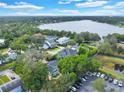 Community overview showcasing waterfront property and mature trees at 245 W George Ave, Maitland, FL 32751