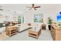 Spacious living room with L-shaped sofa and wood furniture at 2610 Calistoga Ave, Kissimmee, FL 34741