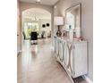 Bright entryway with tile flooring and a console table at 3475 Sandalwood Isle Way, Ocoee, FL 34761