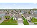 An aerial view showcasing a residential neighborhood with houses and landscaping at 4001 Scarlet Branch Rd, Orlando, FL 32824