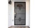 Black metal security door with a keypad lock at 6632 Meritmoor, Orlando, FL 32818