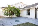 House entrance with a security door and a citrus tree at 6632 Meritmoor, Orlando, FL 32818