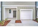 Attached garage with a private entrance at 246 Mandovi St, Davenport, FL 33837