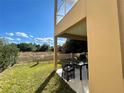 Private backyard with patio furniture and a view of open space at 3131 Brasilia Ave, Kissimmee, FL 34747