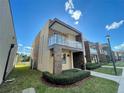 Modern two-story home with balcony and landscaped yard at 3131 Brasilia Ave, Kissimmee, FL 34747