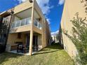 Backyard patio with grill and seating area next to a modern home at 3131 Brasilia Ave, Kissimmee, FL 34747