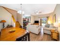 Open concept living and dining area with hardwood floors at 3520 Calabria Ave # 3520, Davenport, FL 33897