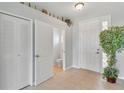 Entryway with tile flooring, half bath, and closet at 480 Scarlatti Ct, Ocoee, FL 34761