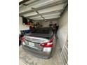 Garage with car and storage space at 6462 Cantua Ln # 105, Orlando, FL 32835