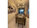 Dining room with table, chairs and view of lanai at 1144 Challenge Dr, Davenport, FL 33896